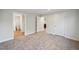 A carpeted main bedroom features access to an ensuite bathroom and closet at 349 Tristen Ln, Henderson, NC 27537