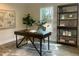 Stylish home office with a modern desk, shelving, a large window, and decor creating a productive atmosphere at 349 Tristen Ln, Henderson, NC 27537