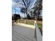 Spacious wooden deck overlooking a green lawn and mature trees, perfect for outdoor enjoyment at 3529 Elk St, Burlington, NC 27215