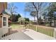 Large back deck overlooking a backyard with mature trees and landscaping at 3529 Elk St, Burlington, NC 27215