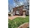 Brick two story home with an expansive backyard, patio, and a lush lawn at 3529 Elk St, Burlington, NC 27215