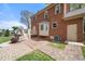 Brick paved backyard with a white wooden deck and a partial view of home at 3529 Elk St, Burlington, NC 27215