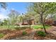 The backyard features a brick patio and manicured lawn at 3529 Elk St, Burlington, NC 27215