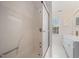 Clean bathroom featuring a shower with glass door and a window above the vanity at 3529 Elk St, Burlington, NC 27215