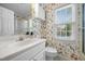 This bathroom features floral wallpaper and a white vanity at 3529 Elk St, Burlington, NC 27215