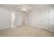 Bright bedroom featuring neutral walls, carpet floors, and a ceiling fan at 3529 Elk St, Burlington, NC 27215