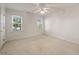 Bright bedroom featuring neutral walls, carpet floors, and two large windows at 3529 Elk St, Burlington, NC 27215