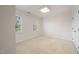 This bedroom features carpeted floors and two windows at 3529 Elk St, Burlington, NC 27215