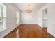 Traditional dining room with hardwood floors, bright windows, and a gold chandelier at 3529 Elk St, Burlington, NC 27215