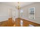 Bright dining room features hardwood floors, chair railing, and a classic chandelier at 3529 Elk St, Burlington, NC 27215