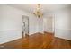 Dining room features gleaming hardwood floors, white walls, and ample natural light at 3529 Elk St, Burlington, NC 27215