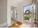 Bright foyer with a view of the landscaped front yard through the glass door at 3529 Elk St, Burlington, NC 27215