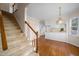 Open kitchen with white cabinets, and eat-in area, adjacent to staircase at 3529 Elk St, Burlington, NC 27215