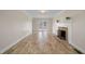 Bright living room featuring a decorative fireplace, neutral walls, and tile flooring at 3529 Elk St, Burlington, NC 27215