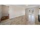 Open concept living room with tile floors and access to a wooden porch through glass doors at 3529 Elk St, Burlington, NC 27215