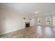 Bright living room featuring a decorative fireplace, neutral walls, and tile flooring at 3529 Elk St, Burlington, NC 27215