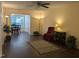 Spacious living room featuring hardwood floors and a cozy sitting area with neutral paint at 3710 Pardue Woods Pl # 103, Raleigh, NC 27606