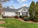 Attractive single-Gathering home showcasing manicured lawn and mature trees at 409 Latta Cir, Durham, NC 27712