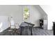 Bright attic room with a large window, desk, and creative workspace at 4300 Camelot Dr, Raleigh, NC 27609