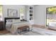 Bright bedroom featuring a large bed, modern decor, and ample natural light from window at 4300 Camelot Dr, Raleigh, NC 27609