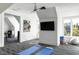 Large bonus room with exercise equipment and TV perfect for a home gym or entertainment space at 4300 Camelot Dr, Raleigh, NC 27609