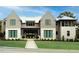 Stunning home with a manicured lawn, stone accents, and a metal roof under a bright blue sky at 4300 Camelot Dr, Raleigh, NC 27609