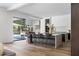 Open-concept kitchen with an island and barstool seating, view of the pool and modern appliances at 4300 Camelot Dr, Raleigh, NC 27609