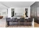 Modern kitchen with a large island, barstool seating, sleek cabinetry, and hardwood flooring at 4300 Camelot Dr, Raleigh, NC 27609