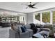 Spacious living room with a large sectional sofa, foosball table, and a bar in the background at 4300 Camelot Dr, Raleigh, NC 27609