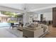 Bright and spacious living room with contemporary furnishings and views of a refreshing outdoor pool at 4300 Camelot Dr, Raleigh, NC 27609