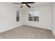 This bedroom offers neutral walls, carpet, and two windows at 4308 Brynwood Ave, Durham, NC 27713
