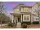 Charming townhome with stone accents, covered front porch, and well-maintained landscaping at 4308 Brynwood Ave, Durham, NC 27713
