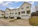 Street view of townhomes with two-car garages, private balconies, and landscaped frontage at 4308 Brynwood Ave, Durham, NC 27713