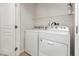 Laundry room with appliances and storage shelving at 4308 Brynwood Ave, Durham, NC 27713