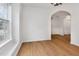 Bright living room with wood floors and a large window offering natural light at 4308 Brynwood Ave, Durham, NC 27713