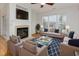Stylishly furnished living room featuring a fireplace and large windows for natural light at 4308 Brynwood Ave, Durham, NC 27713