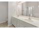 Bright main bathroom with double sinks, large mirror, and glass enclosed shower at 4308 Brynwood Ave, Durham, NC 27713