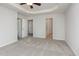Spacious main bedroom featuring neutral walls and carpet, trey ceiling, and a ceiling fan at 4308 Brynwood Ave, Durham, NC 27713