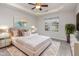 Beautifully staged main bedroom featuring a trey ceiling, ceiling fan, and plush rug at 4308 Brynwood Ave, Durham, NC 27713