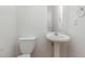 Powder room with pedestal sink and neutral finishes at 4308 Brynwood Ave, Durham, NC 27713