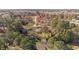 Aerial view of the property showcasing the home nestled among mature trees in the surrounding landscape at 4316 Old Faison Rd, Knightdale, NC 27545