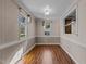 Dining room features hardwood floors, two windows for natural light, and neutral walls, perfect for gatherings at 4316 Old Faison Rd, Knightdale, NC 27545