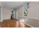 Bright living room features hardwood floors, neutral walls, and windows offering a view of the exterior at 4316 Old Faison Rd, Knightdale, NC 27545