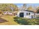 View of an outbuilding with a roll up garage door and adjacent to the home at 4316 Old Faison Rd, Knightdale, NC 27545