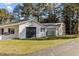 Outbuilding on the property with a roll-up door, and easy access to the main home at 4316 Old Faison Rd, Knightdale, NC 27545