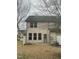 View of the backyard features a small patio area, grass and vinyl siding at 4469 Middletown Dr, Wake Forest, NC 27587