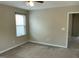 Neutral bedroom with carpet, blinds, natural light from window, and electrical outlets at 4469 Middletown Dr, Wake Forest, NC 27587