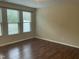 Bedroom with neutral walls, wood floors, and a window with horizontal blinds at 4469 Middletown Dr, Wake Forest, NC 27587