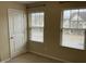This bedroom has two windows with blinds and a carpeted floor at 4469 Middletown Dr, Wake Forest, NC 27587