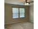 Neutral bedroom with carpet, blinds, natural light from two windows, and electrical outlets at 4469 Middletown Dr, Wake Forest, NC 27587